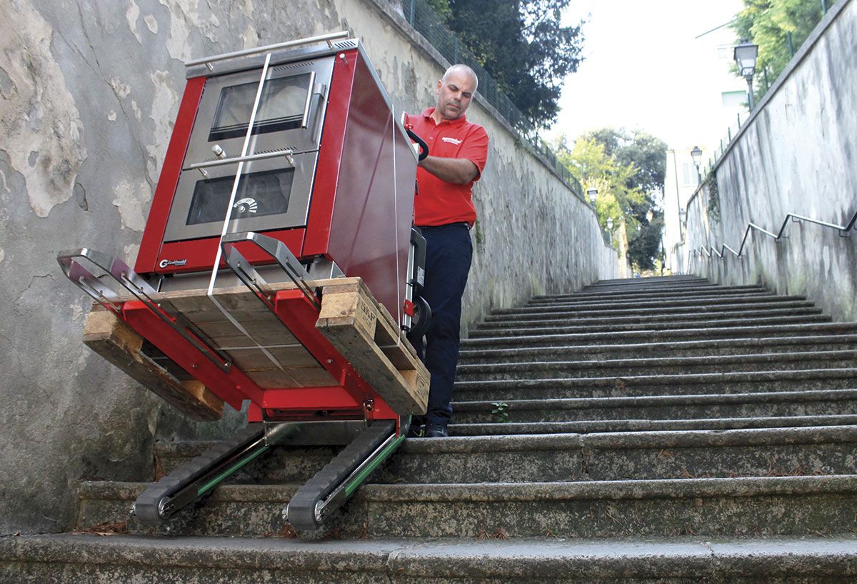 Electric stair climber Domino PT transporting pallets on long industrial stairways