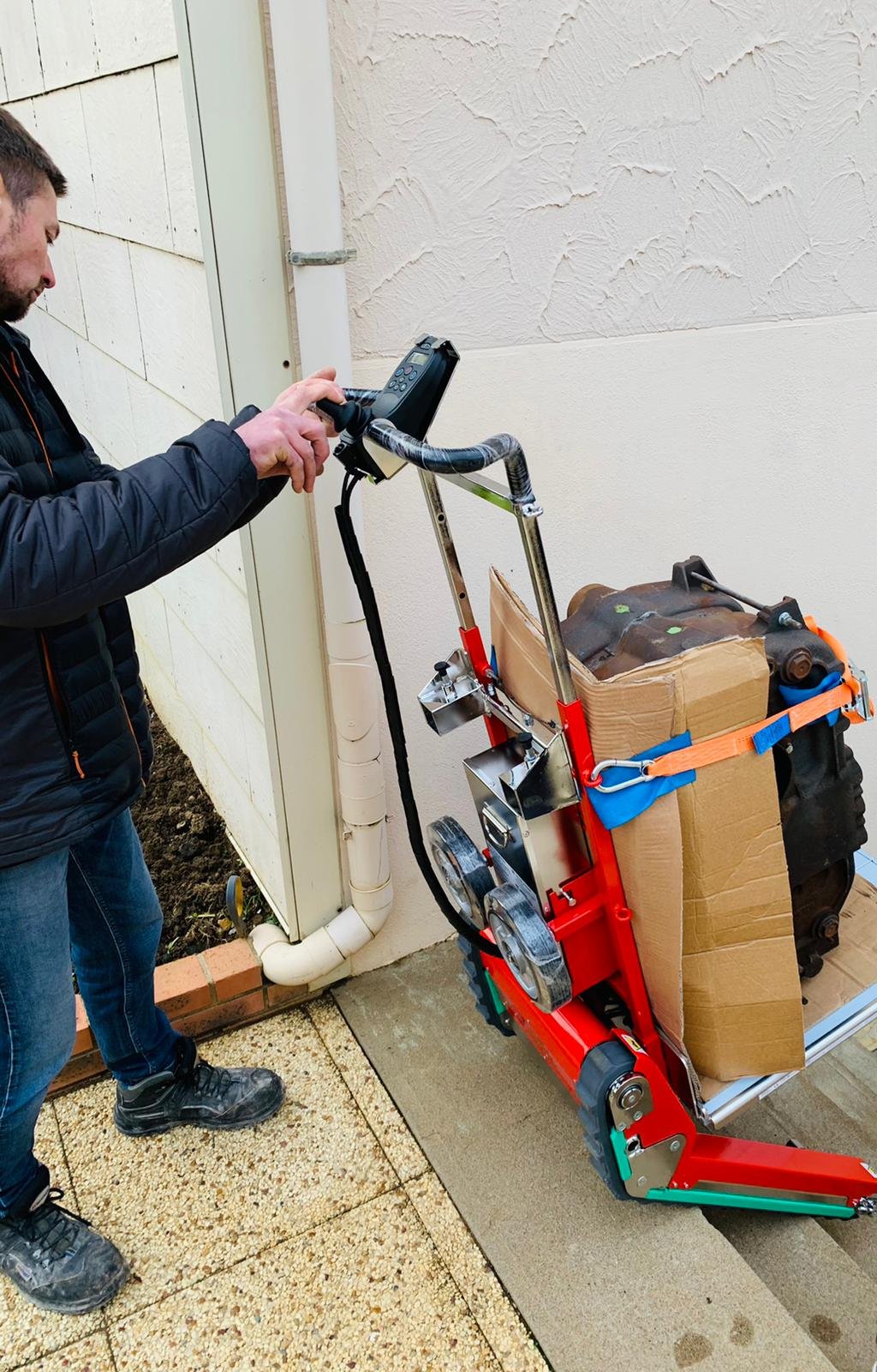 Stair climbing trolley for backup generator delivery to floors