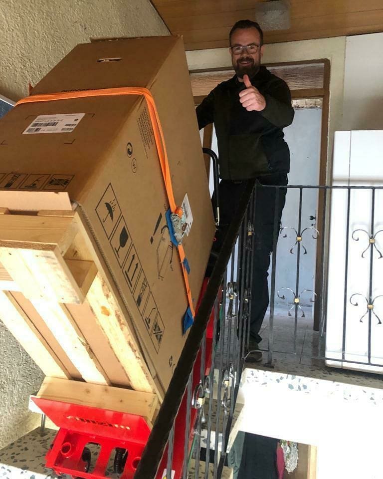 Electric stair climber for water heater transport to upper floors