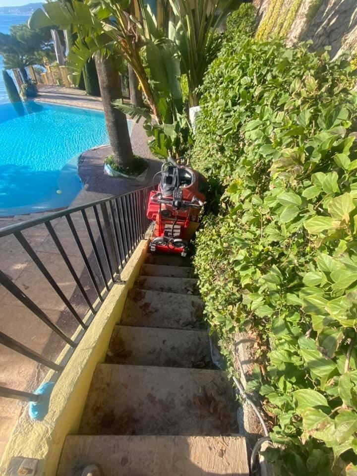 Electric stair climber for masonry equipment delivery on stairs