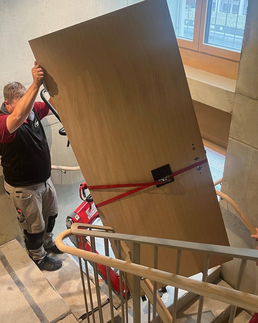 Professional stair climber for wooden window frame delivery to upper floors