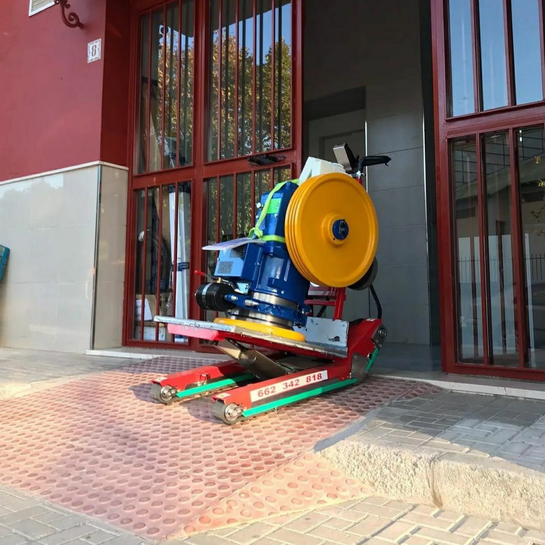 Zonzini stair climber for elevator motor handling