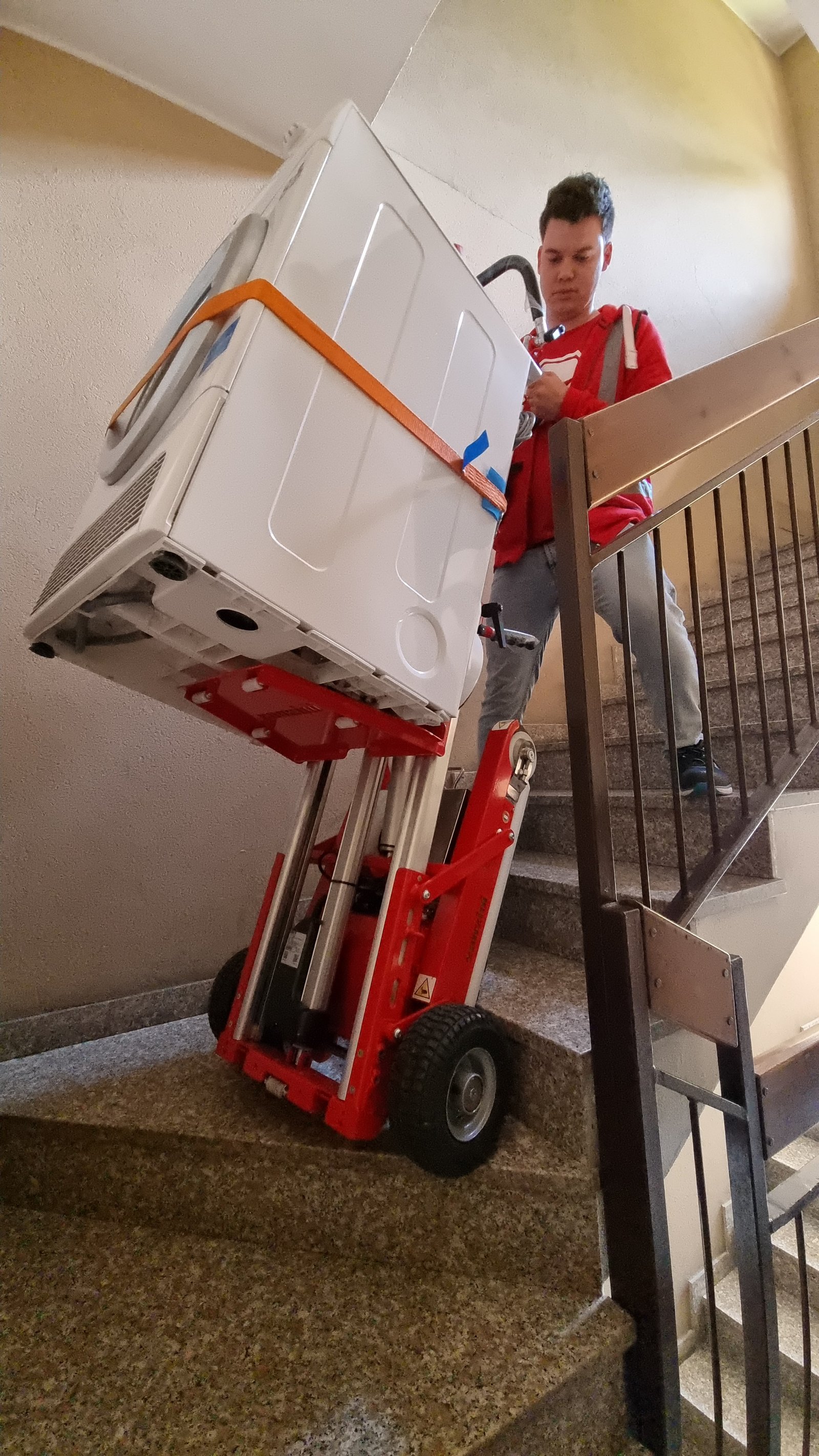 Electric stair climber for appliance delivery in building