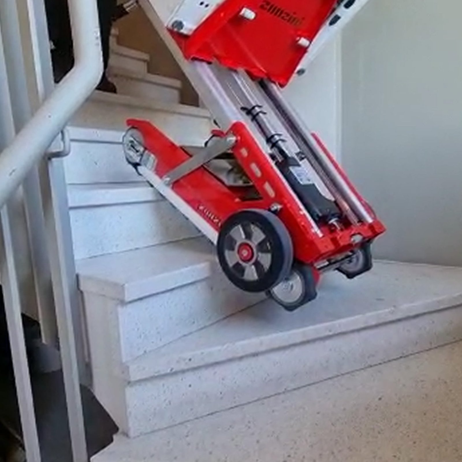 Electric stair climber for washing machine transport to upper floors