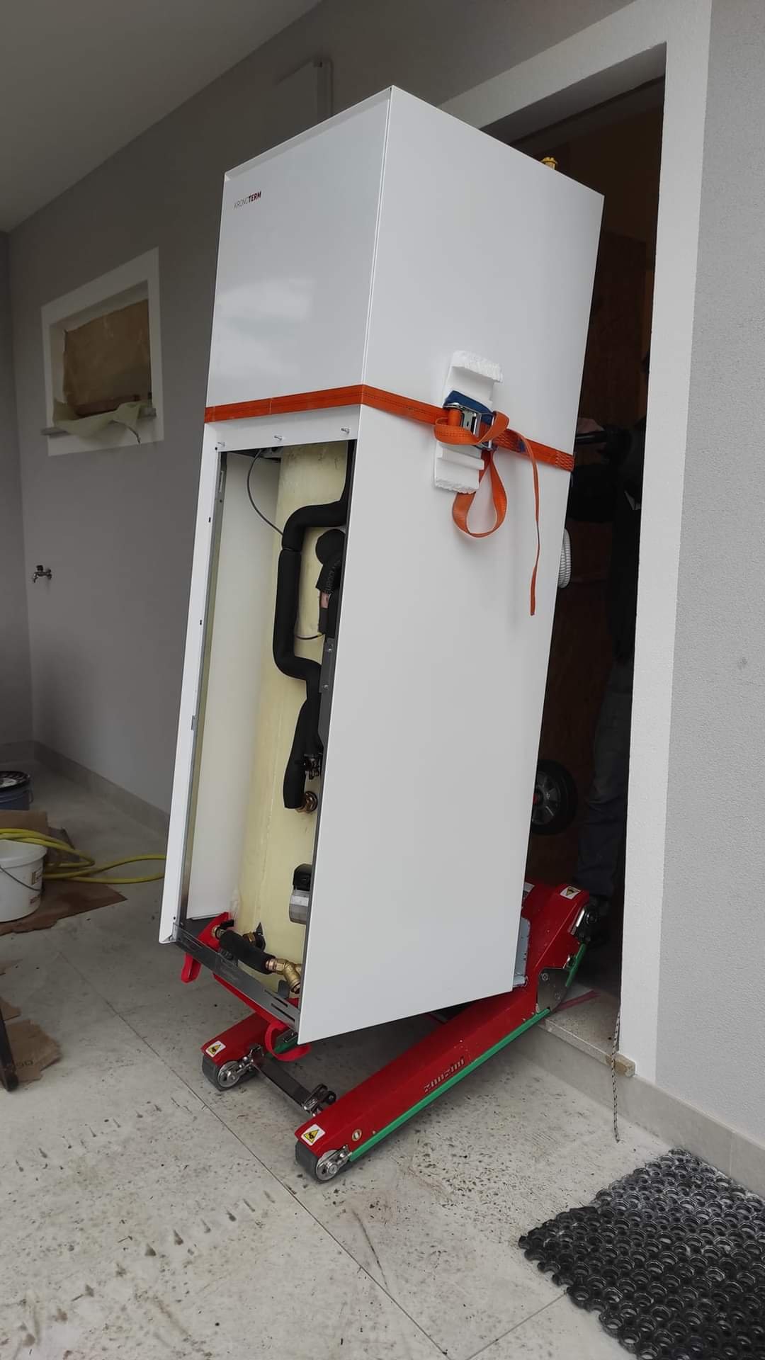 Electric stair climbing dolly for refrigerated display case on stairs