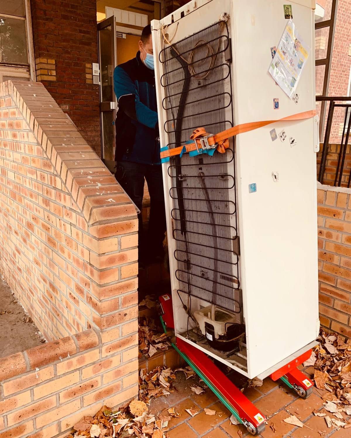 Professional stair climber for bar fridge transport to upper floors