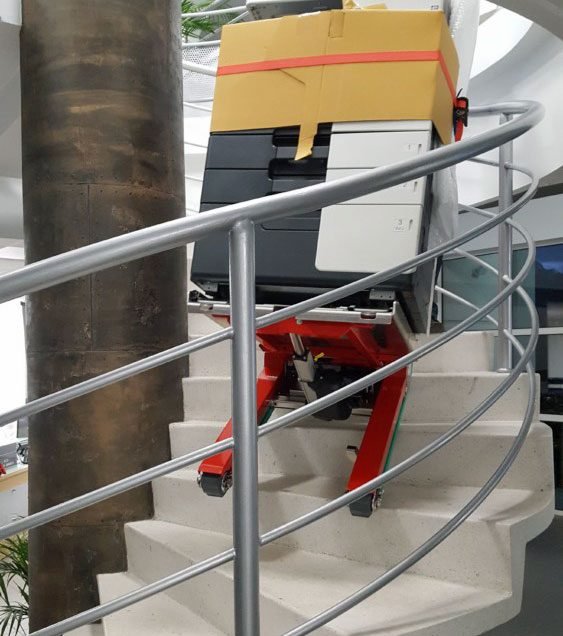 Electric stair climber with photocopier on spiral stairs