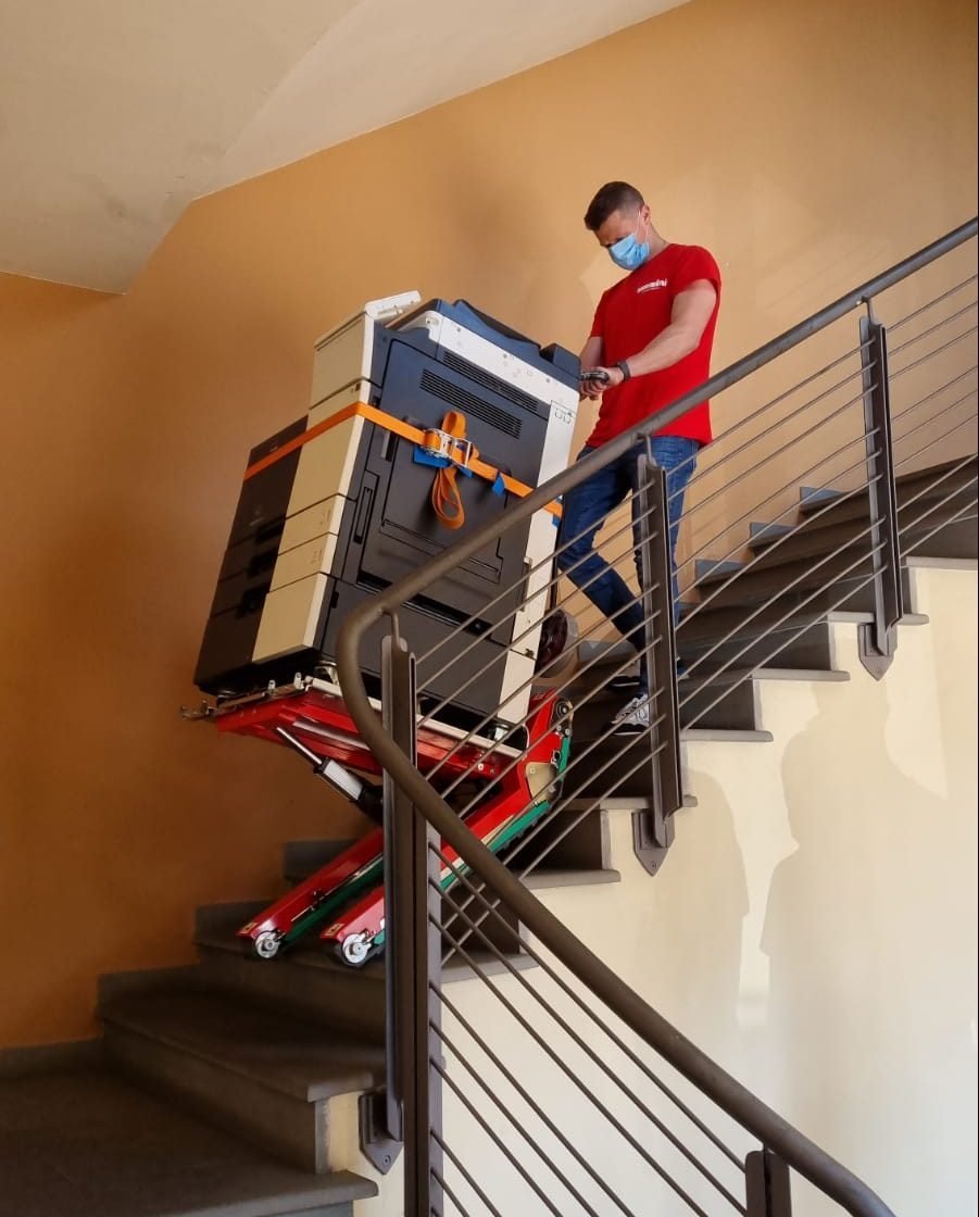 Professional photocopier transport on stairs