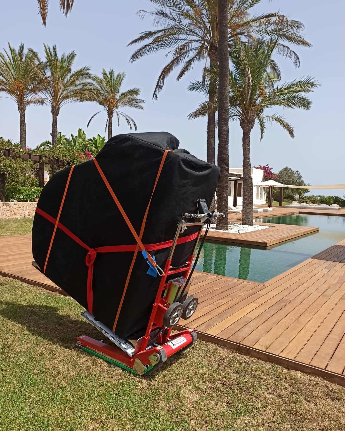 Electric stair climber for piano delivery to villa