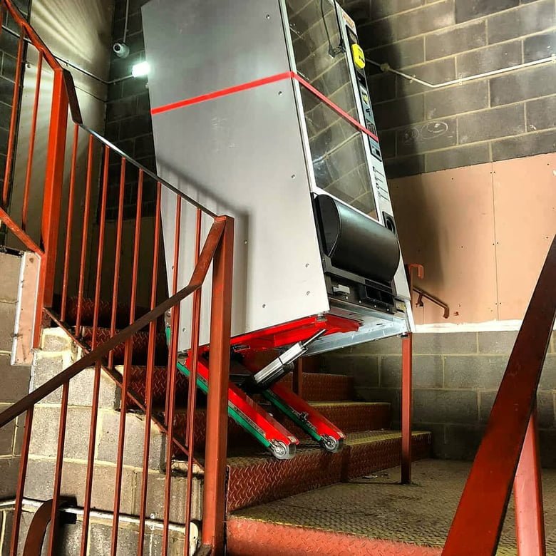 Stair climbing trolley for vending machine delivery to apartment